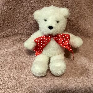Dakin 1993 mini bear with red polka dot ribbon. New